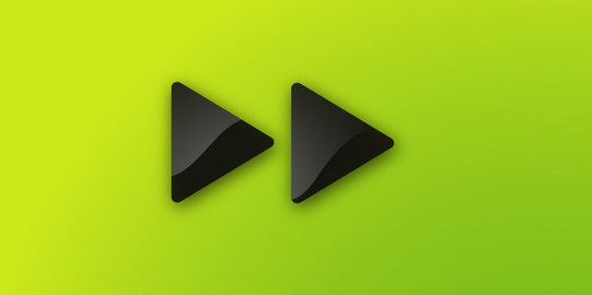 Two dark grey triangles pointing to the right on a green background